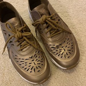 Gold Nike Air Thea with laser cut detailing
